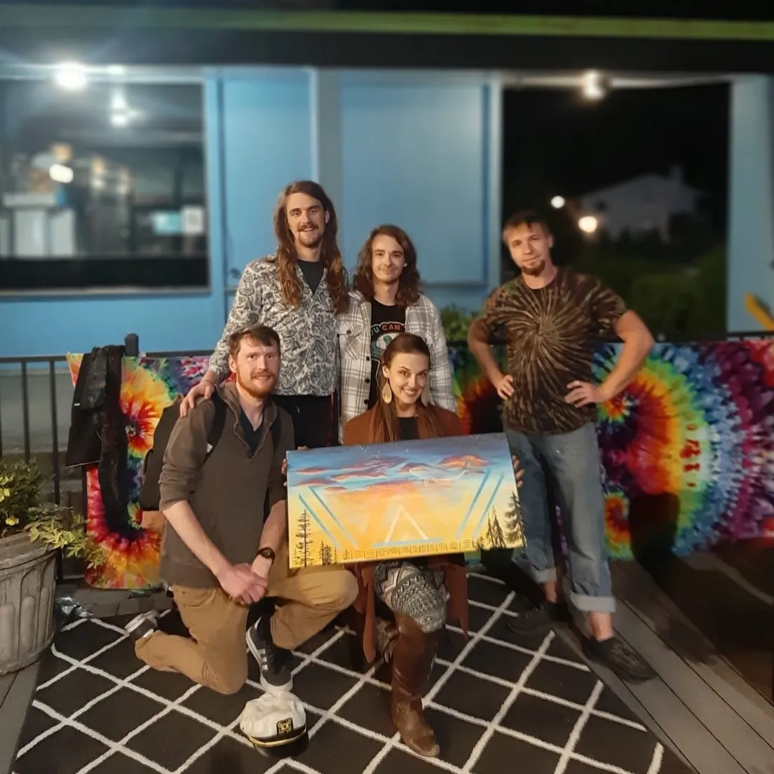 Irisa and musicians with a Space Whales painting